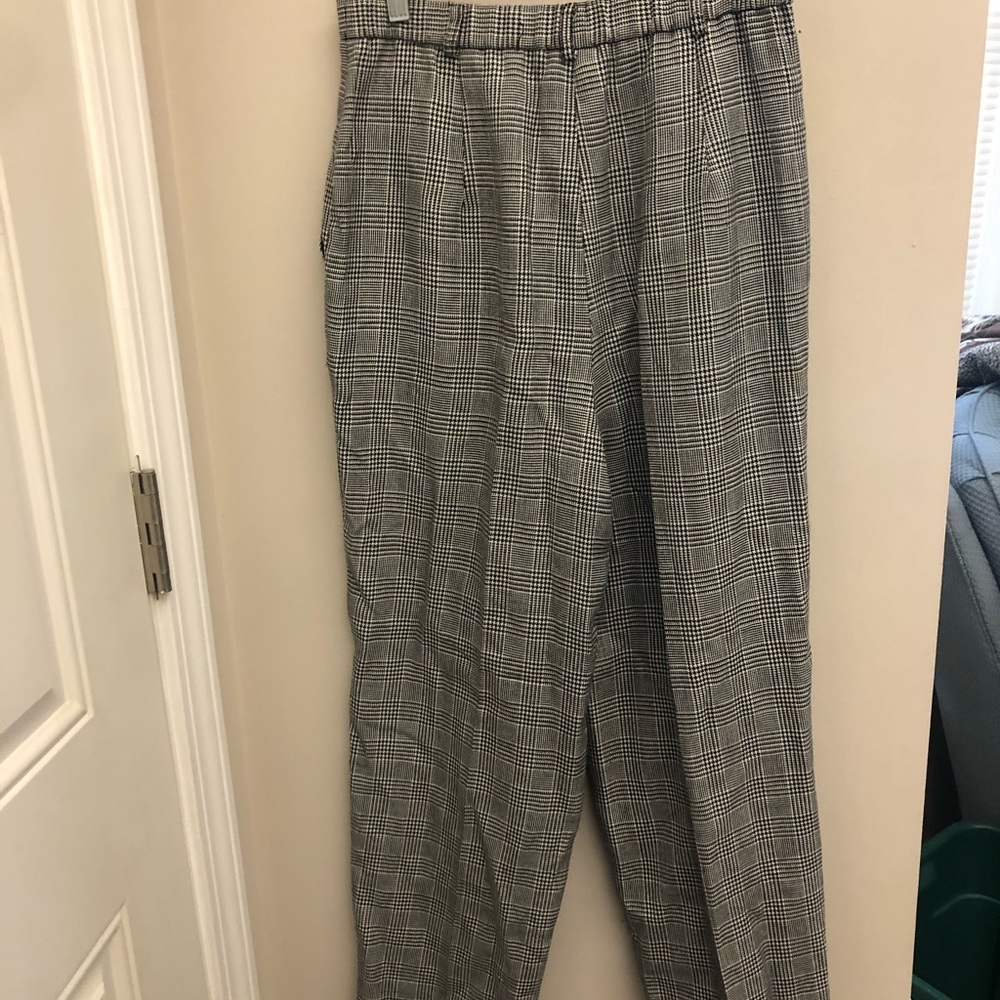Slim leg trousers. Black and white. 90s era.